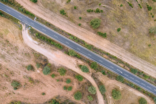 Aerial view of a road crossing the countryside along the Spanish and Portuguese border, Zebreira, Castel Branco, Portugal.