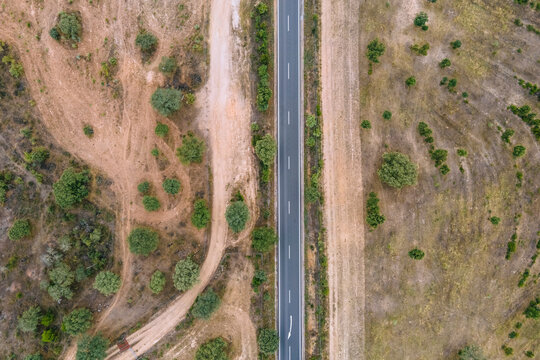 Aerial view of a road crossing the countryside along the Spanish and Portuguese border, Zebreira, Castel Branco, Portugal.