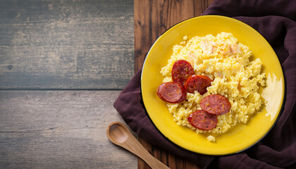 couscous with scrambled eggs and pepperoni sausage on bamboo mat cuzcuz