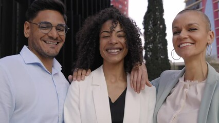 Portrait of happy business people taking photo with a phone. Multiracial teamwork taking a selfie of a group of colleagues looking at camera. Diverse office workers in a financial center - Powered by Adobe