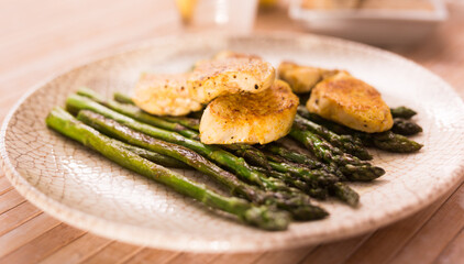 dietary meal rich in protein. Stir fried chicken breast and green asparagus