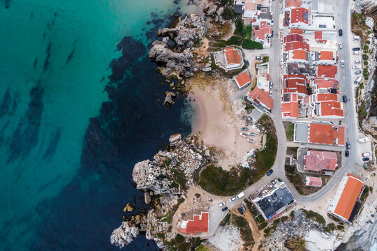 Aerial view of Praia dos Barcos, a small inlet with beach along the coastline in Baleal, a small town on island in Leiria, Portugal.