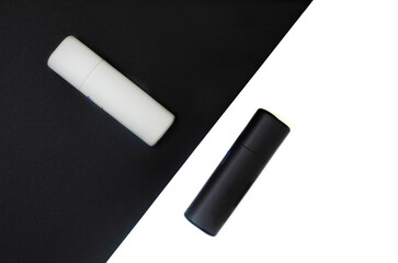 Close-up of a black and white electric hybrid cigarette heater.