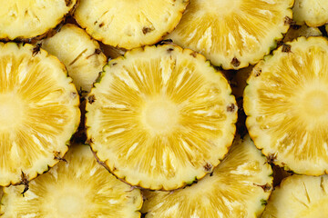 Top view. Pineapple fruit juicy yellow slices for background.