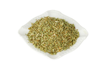 White plate with oregano spices. Isolate on a white background.