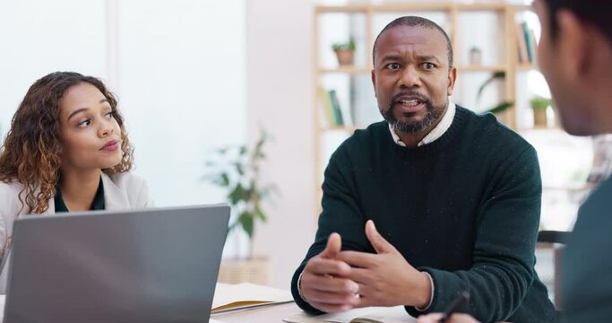 Meeting, planning and a senior business black man talking to his team for coaching as a mentor in a workshop. Management, strategy and collaboration with a mature male CEO chatting in a staff seminar