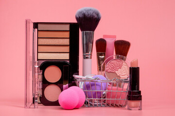 Fototapeta Professional makeup tools. Makeup products on pink background. A set of various products for makeup obraz