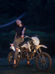 Obraz na płótnie Canvas Sensual biker girl on motocross bike