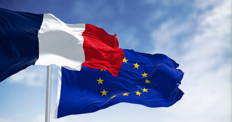 The flags of France and the European Union waving together on a clear day - obrazy, fototapety, plakaty
