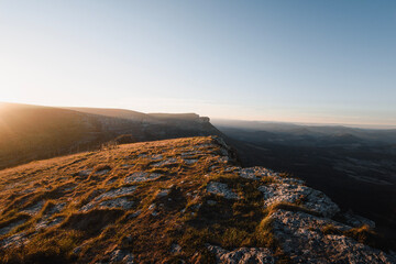 top of Tologorri illuminated by warm lights at sunset, overlooking the entire Gorobel mountain range and Ungino peak. Between Alava and Bizkaia in the Basque Country