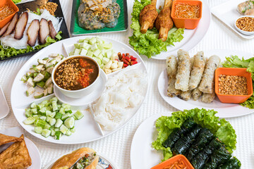 Assorted asian dinner, vietnamese food. Pho ga, pho bo, noodles, spring rolls, Nham due