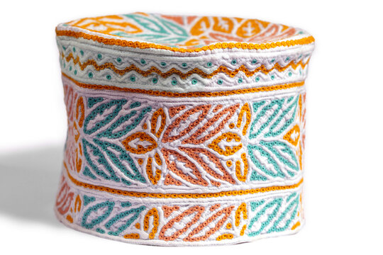 Men traditional muslim cap worn in Oman. Omani cap called kumma on the white background