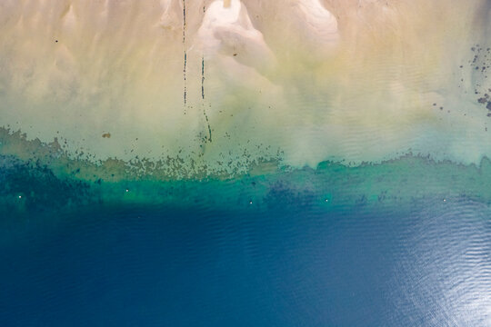 Aerial view of low tide shoreline along Moana coastline, Vigo, Galicia, Spain.
