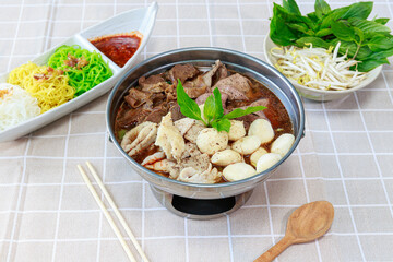 Braised Beef Soup in Hot Pot. One type of noodle dish that is popular in Thailand is called Boat Noodle Hot Pot. Served with different kinds of noodles such as rice vermicelli, thin noodles