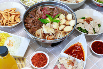Thai boat noodles with Thai spices and ingredient on background.