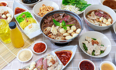 Thai boat noodles with Thai spices and ingredient on background.