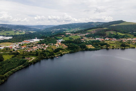 Aerial view of a small village along the Minho river in Val de Pereira, Ourense, Spain.