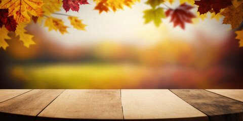 Naklejka na ściany i meble Empty Tabletop on a Abstract Autumn blurred Background with colorful Maple Leaves and Brown Wooden plank table, copy space.