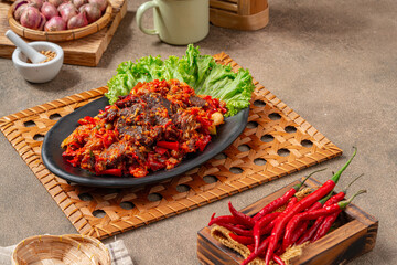 Jerado balado or Dendeng balado is a traditional cuisine from west sumatera, indonesia. it is made...