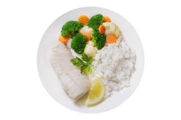 Plate of cod fish fillet with rice and vegetables isolated on transparent background, top view