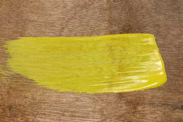 yellow sponge on a wooden background