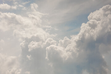 white storm clouds in sky background of nature. weather and climatic conditions, ecology. view of clouds from airplane window. Flight and freedom are religion. The top of sky and atmosphere, solar