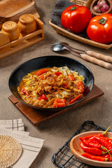 Tongseng is beef stew dish in curry-like soup, with vegetables and sweet soy sauce