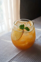 Roasted Barley Tea Blended with Apple Juice Served with Ice, Fresh Mint and Sliced Apple