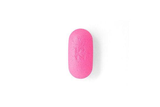25mg Pink diphenhydramine allergy pill isolated on white background with shadow