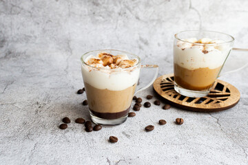 Coffee dessert. On a gray background.
Classic tiramisu in a cup