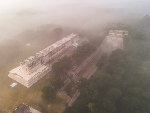 Aerial view of the ancient city of Uxmal with mist, an archeological site in Yucatan, Mexico.
