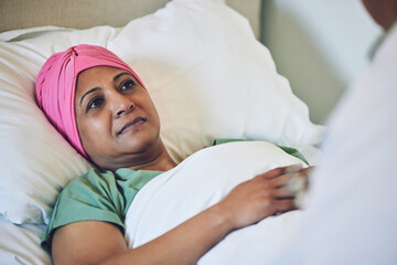 Medical, healthcare and cancer with muslim woman in bed at hospital for treatment or recovery. Islam, medicine or sad person in hospice with a sick or tired mature patient in clinic for chemotherapy - obrazy, fototapety, plakaty