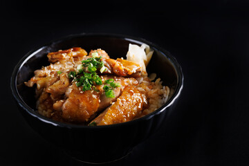 Grilled Chicken teriyaki rice Japanese food isolated in black background