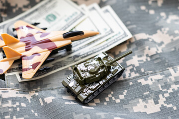 The main battle tank on US dollar bill banknotes background. U.S.A. and China trade war and currency war concept. U.S. fights against terrorism or sells arms weapons to other countries concept.