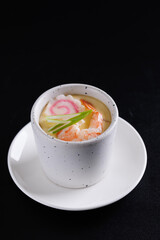 Japanese Traditional food Eggs Custard Chawanmushi isolated in black background