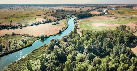 Aerial landscape. Warta river Greater Poland Voivodeship. Forests and meadows from above - obrazy, fototapety, plakaty