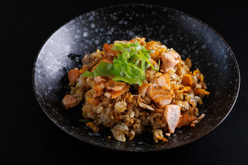 Japanese fried rice yakimeshi isolated in black background