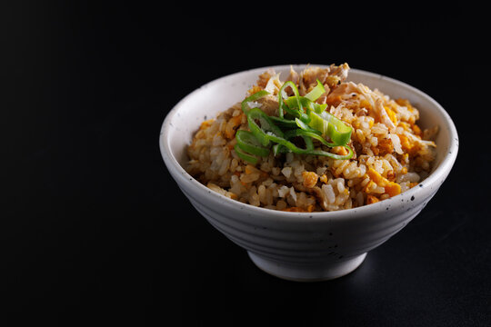 Japanese fried rice yakimeshi isolated in black background