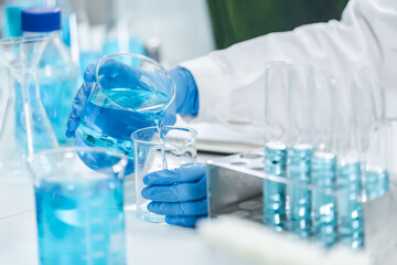 medicine research in chemical laboratory, chemist scientist working with liquid experiment test...