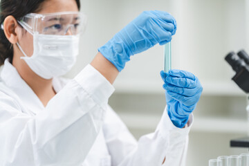 medicine research in chemical laboratory, chemist scientist working with liquid experiment test analysis by using scientific tube beaker glassware, chemistry science pharmaceutical medical lab concept