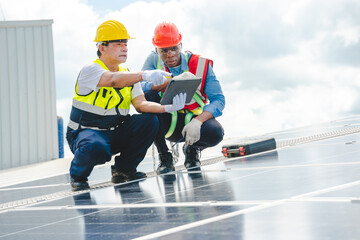 Male engineering teams install solar panels at solar power generating station, Professional engineer installing photovoltaic panel system using screwdriver, green energy and sustainable living