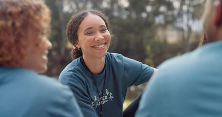 Volunteer, smile and a camp counselor group talking outdoor while planning at an outreach program for the community. Forest, happy or social with friends sitting outside in conversation about charity