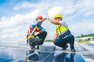 Engineer technician team using laptop checking and operating system on rooftop of plant farm, Renewable energy source for electricity and power, Solar cell panel maintenance service concept © chokniti