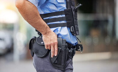 Gun, uniform and police in the city for crime, security and outdoor justice in the street. Law,...