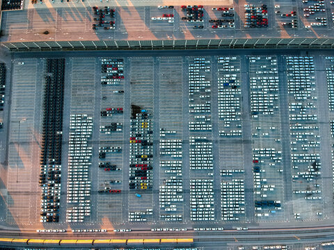 Aerial view of new vehicles parked at Koper commercial port in Slovenia.