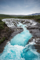 Bruarfoss waterfall in summer season in Iceland. Famous nature landscape background