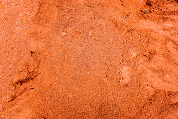 Bricks crushed red dust. Crushed red brick as a texture background of natural materials