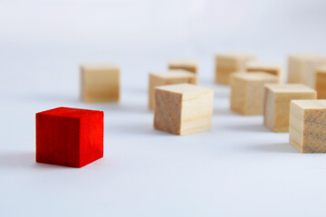 Group of wooden cubes where one is of a different color