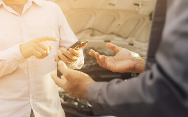 mechanic checking engine security testing tools before customers travel far