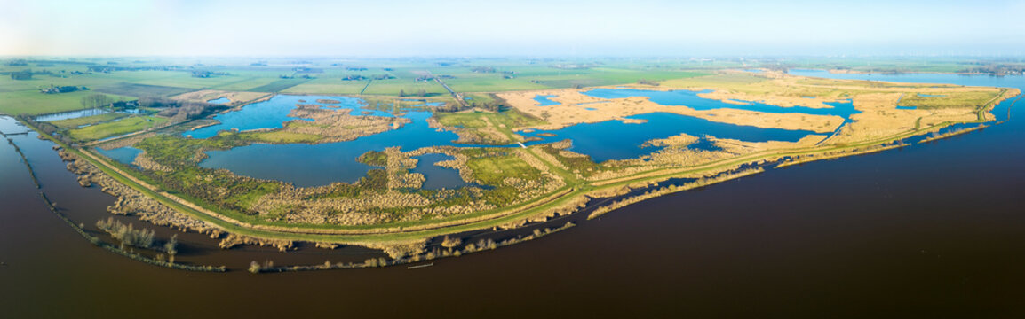 Aerial panorama of the entire nature reserve Tetjehorn with reed swamp and lakes, seen from lake Schildmeer, 't Roegwold, province of Groningen, The Netherlands.